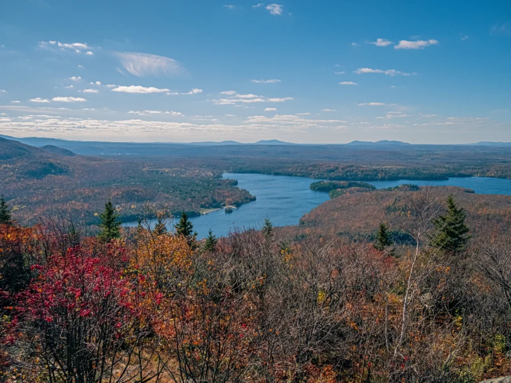 Best Weekend Getaways from NYC: Top Picks for 2025 Scenic view of the Catskills in fall with colorful foliage, perfect for hiking, tubing, or cozy winter retreats near Windham Mountain and Esopus Creek.